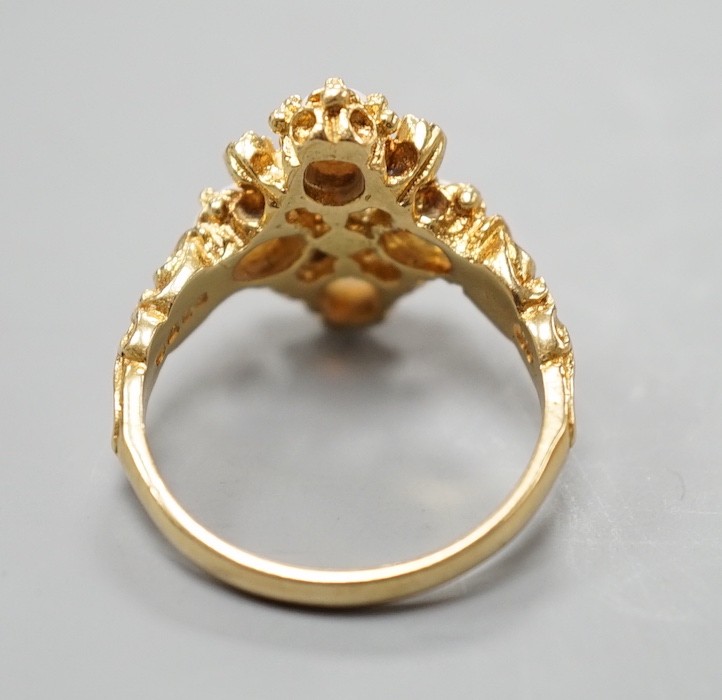 A 1970's 18ct gold, white opal and diamond chip set quatrefoil shaped ring, size O, gross weight 6.1 grams.